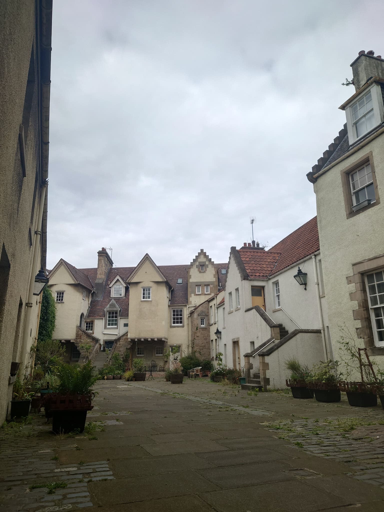 Historic stone courtyard and forestair at White Horse Close in the Canongate