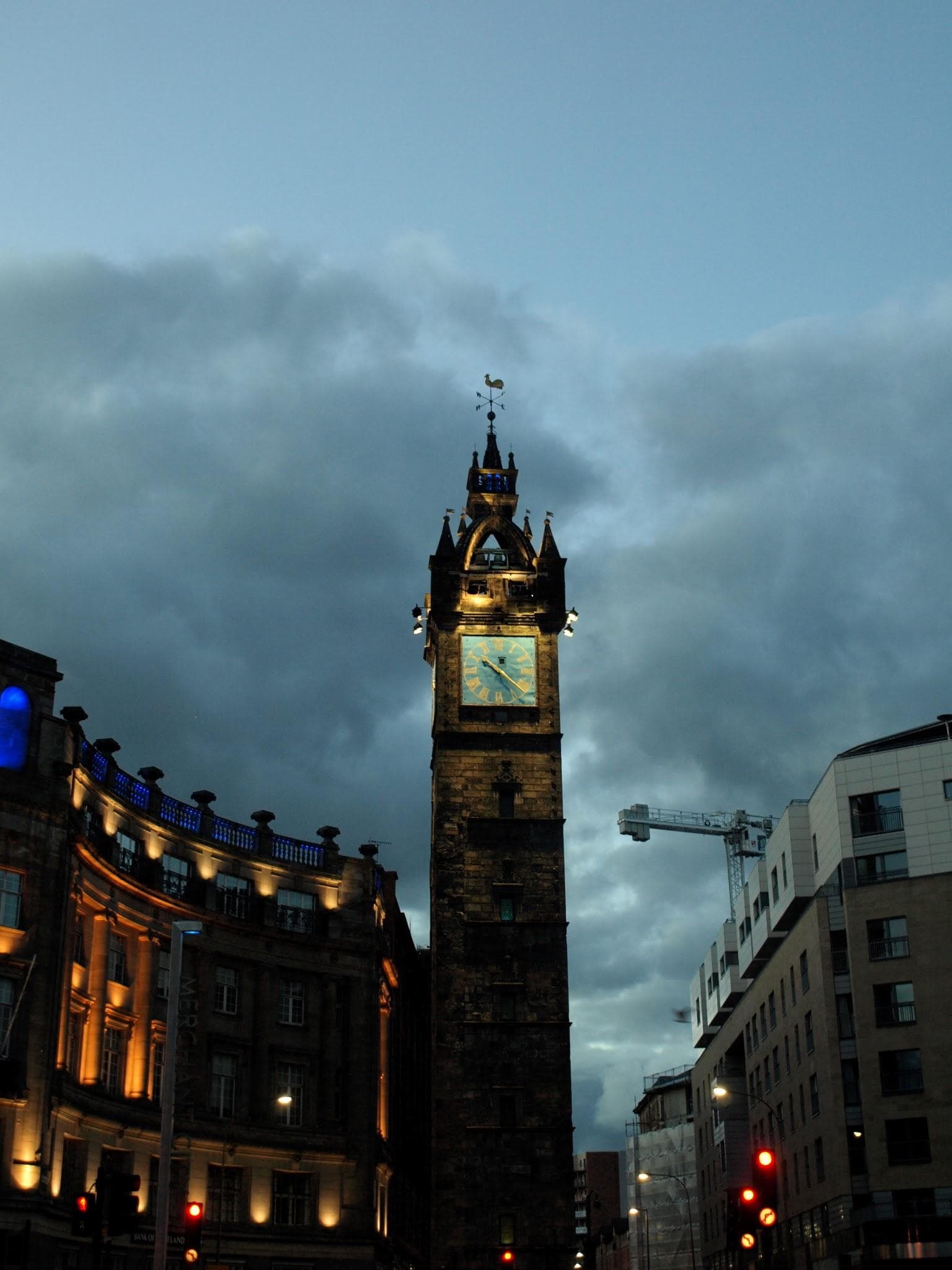 Trongate and Glasgow Cross illuminated at night with Tolbooth Steeple