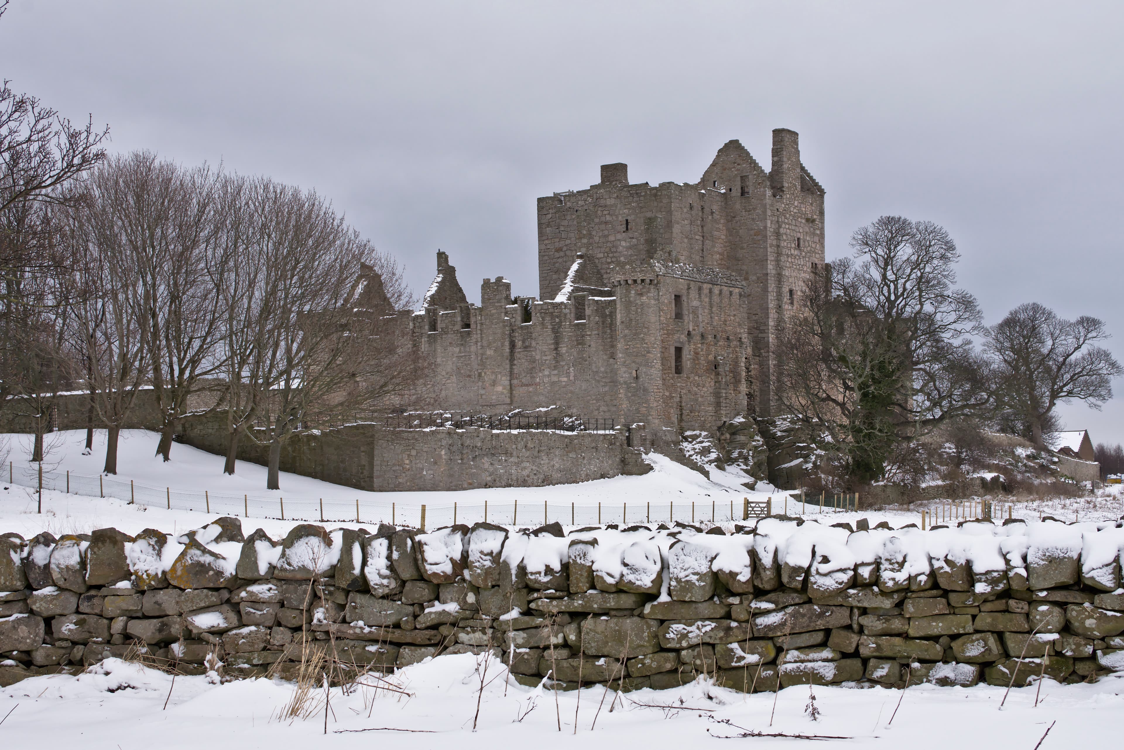 Ruins of Craigmillar Castle medieval tower house and curtain walls