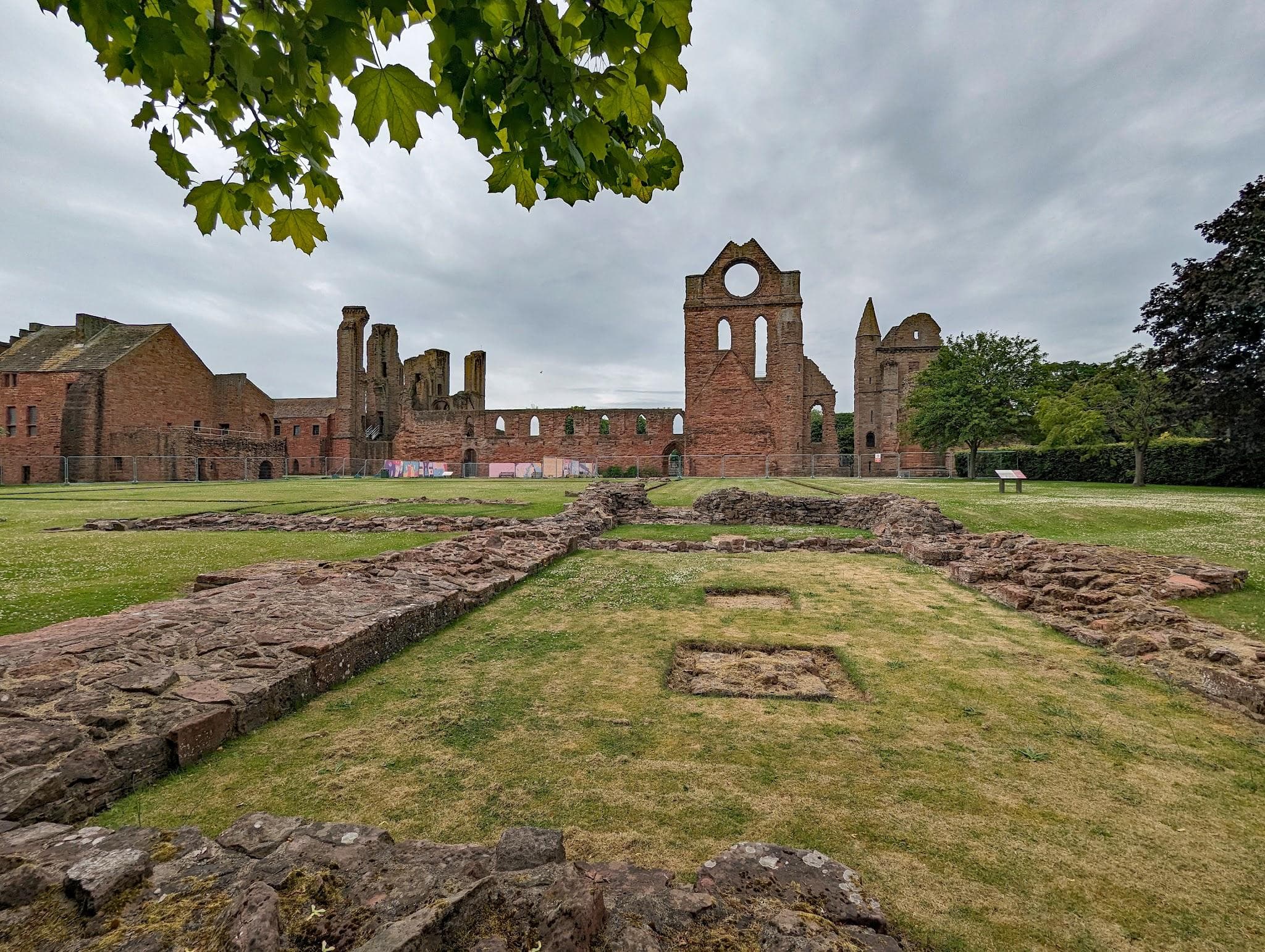Red sandstone medieval ruins and west front of Arbroath Abbey.