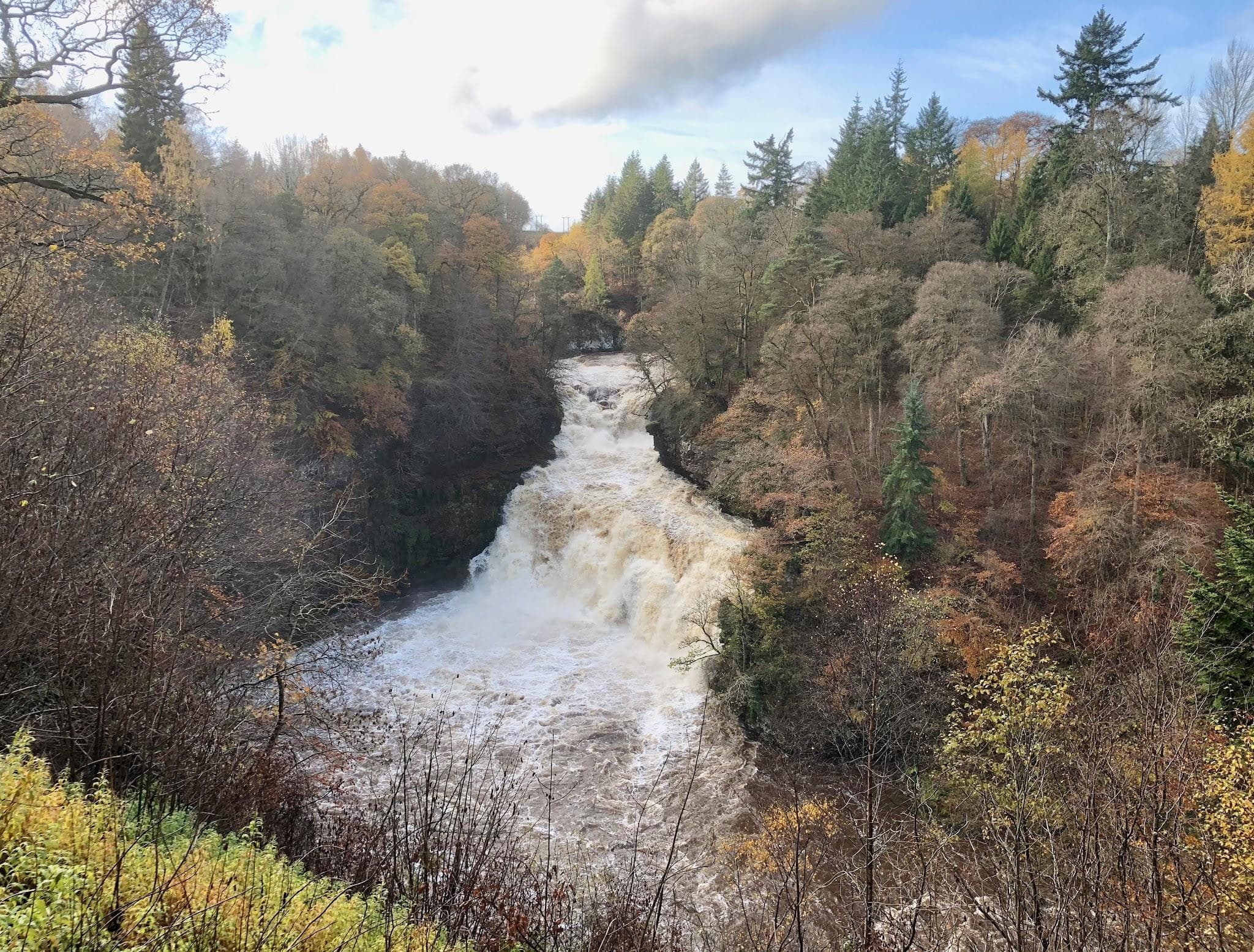 Corra Linn waterfall in dramatic spate on the River Clyde gorge.