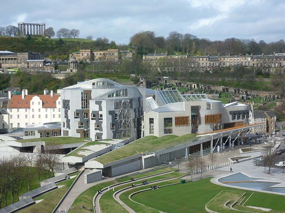 Contemporary granite, oak and stainless steel facade of the Scottish Parliament.