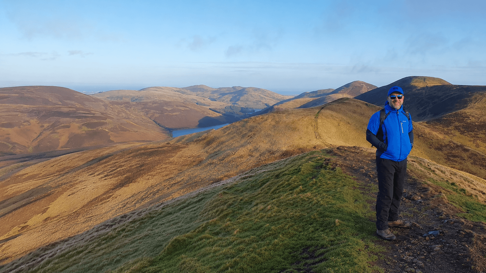 Ross McDowell standing on a Pentland Hills summit near Edinburgh.