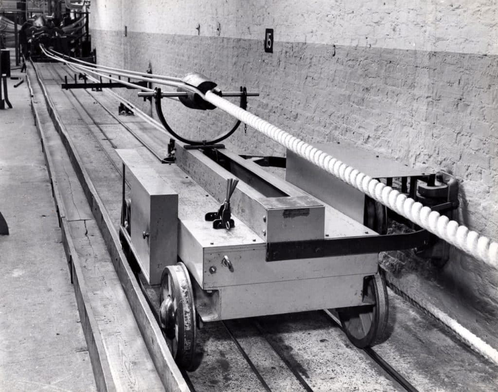 Rope production trolley cart along an industrial ropewalk section