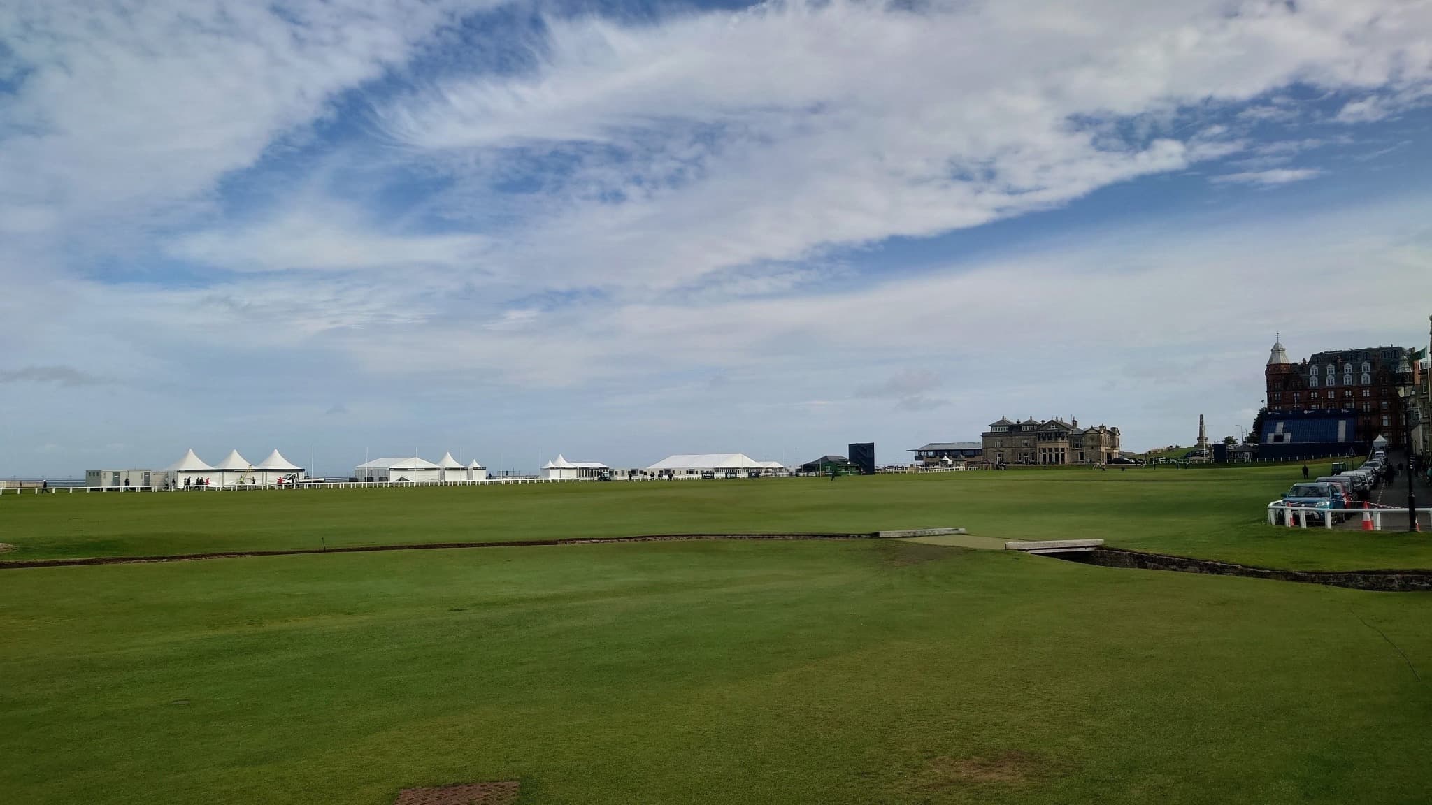 Event structures and hospitality tents being prepared beside the Old Course at St Andrews.